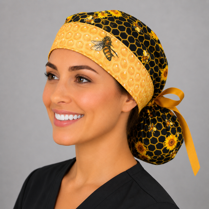 Honey bee honeycomb ponytail nurse cap right three-quarter angle showing bee band and full ponytail pouch