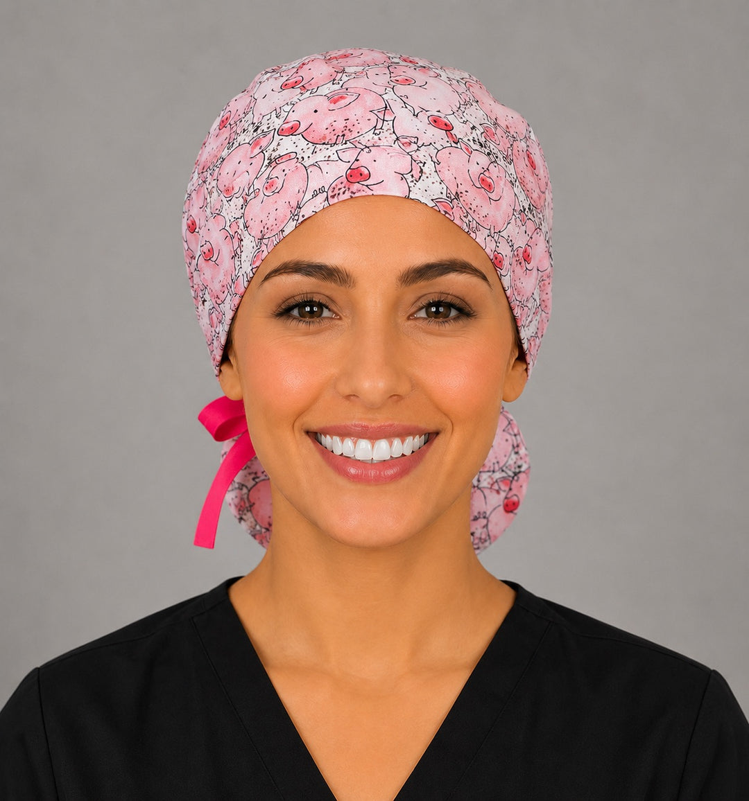 Pink pig ponytail scrub cap back view on mannequin showing gathered pouch full of cute cartoon pigs and hot pink ribbon bow