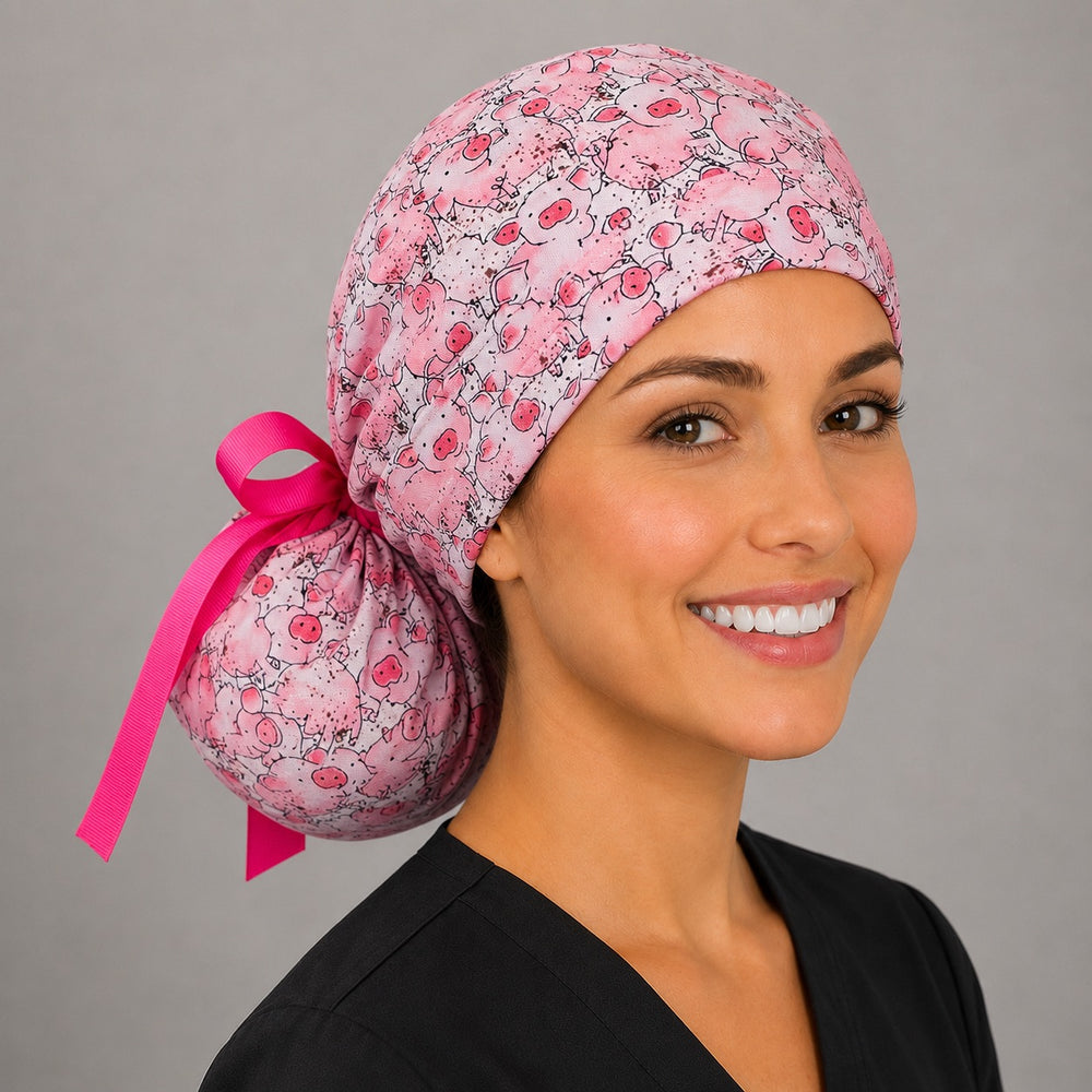 Pink pig ponytail scrub cap right angle showing full ponytail pouch of cute pigs and hot pink ribbon bow on smiling model