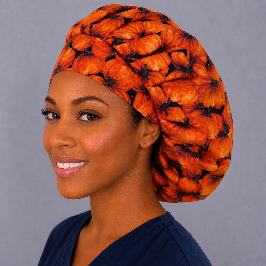 Back view of the pumpkin patch bouffant scrub cap — full roomy fit showing all-over orange pumpkins with complete hair coverage