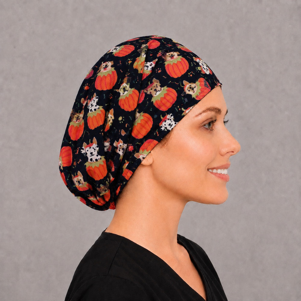 Right side profile of the pumpkin puppy Euro surgical hat — Dalmatian and corgi print, breathable cotton cap for vet techs