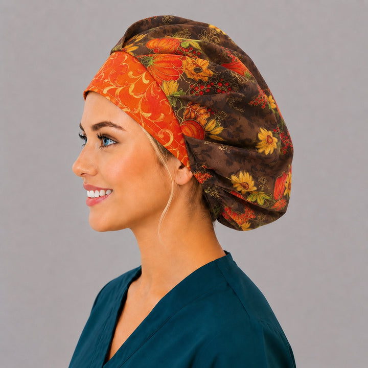 Left side profile of the pumpkin and sunflower bouffant surgical hat — autumn floral print with gold filigree, roomy breathable cotton cap for nurses