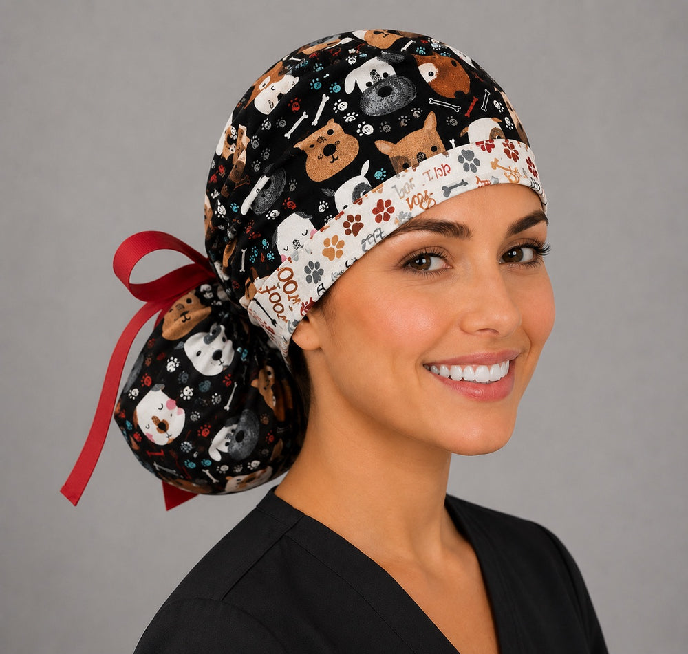 Puppy dog lover ponytail nurse cap left three-quarter angle showing gathered ponytail pouch of dog faces, bones and woof word band with red ribbon bow