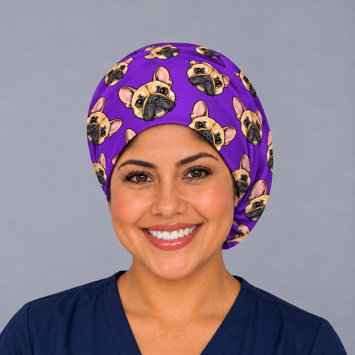 Front view of a purple cartoon dog euro scrub cap with custom pet faces, a personalized surgical hat for surgical techs and surgical nurses