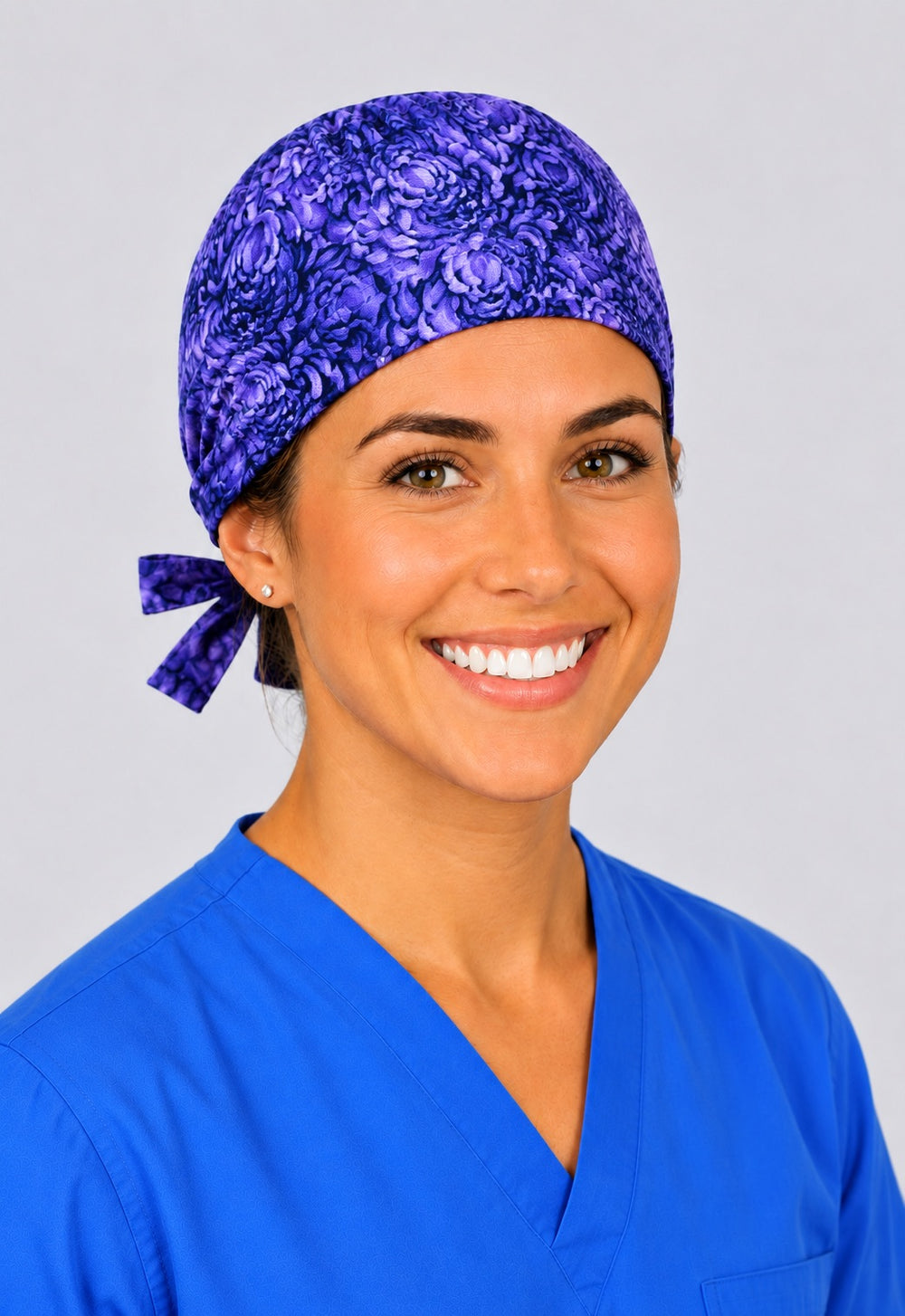 Back view of adjustable tie-back knot on purple floral euro scrub cap for short hair