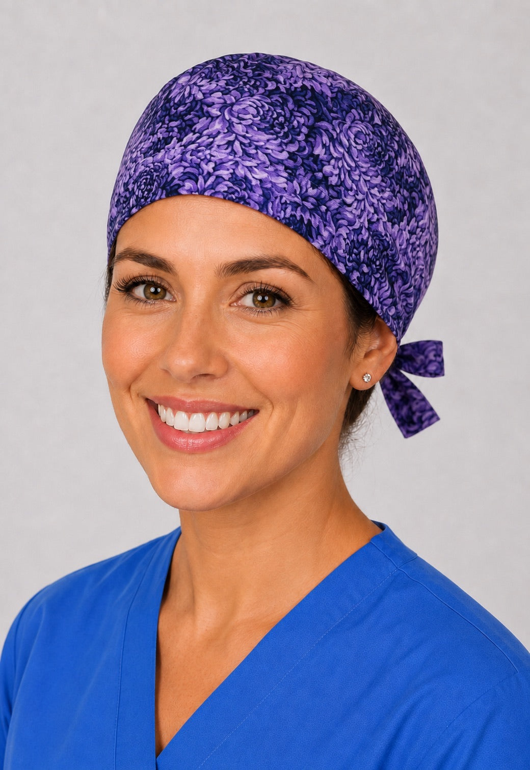 Purple floral euro scrub cap for women with short hair, handmade violet petal surgical hat, three-quarter view