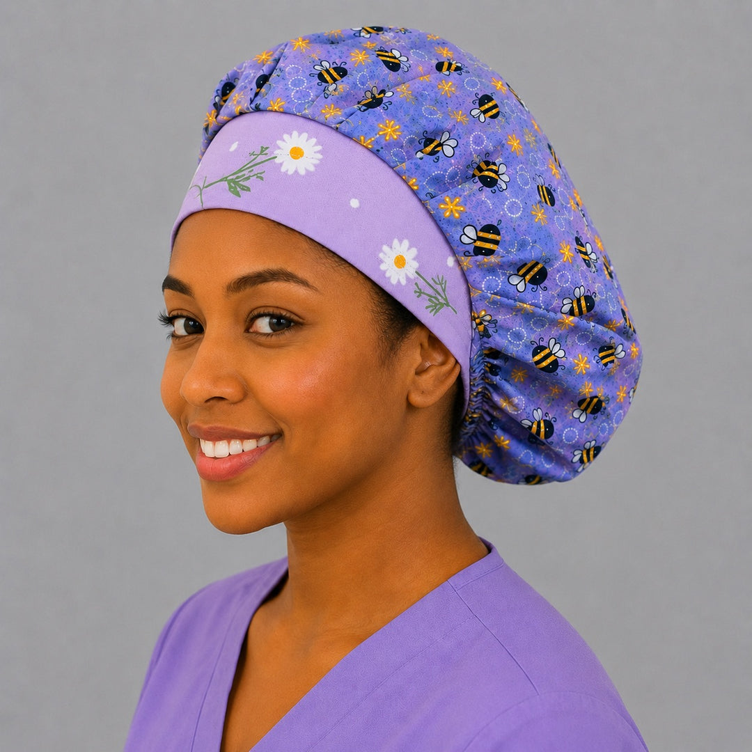 Purple honeybee floral bouffant cap side smile view — lavender bee print roomy surgical cap for OR nurses with elastic adjustable fit
