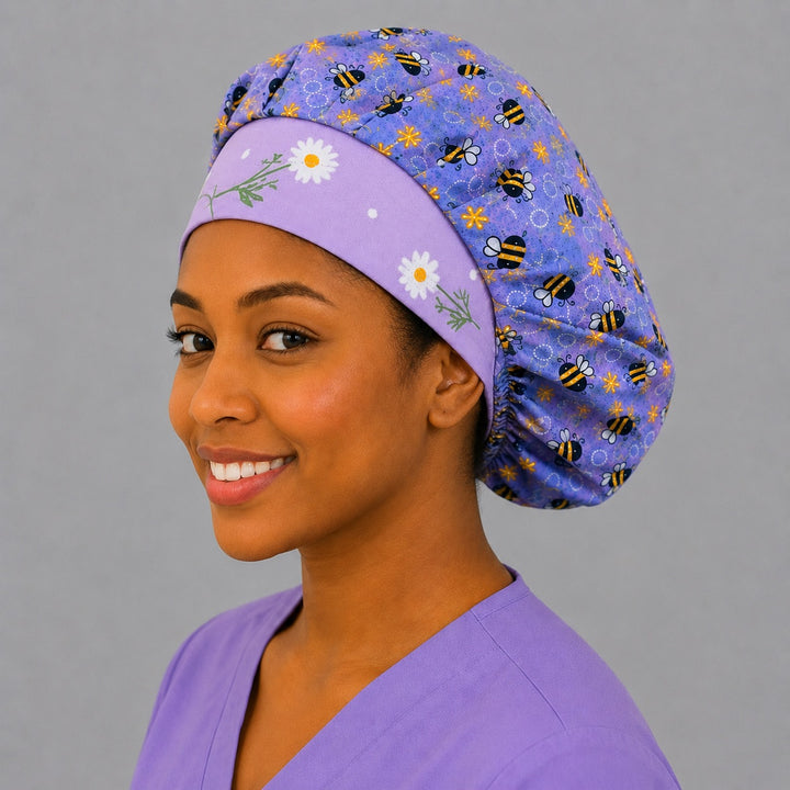 Purple honeybee floral bouffant cap side smile view — lavender bee print roomy surgical cap for OR nurses with elastic adjustable fit