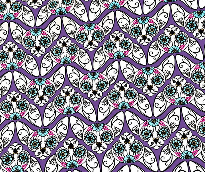 Close-up of the purple sugar skull cat fabric for this Mexican scrub cap, teal flower eyes, pink accents and spiderweb details
