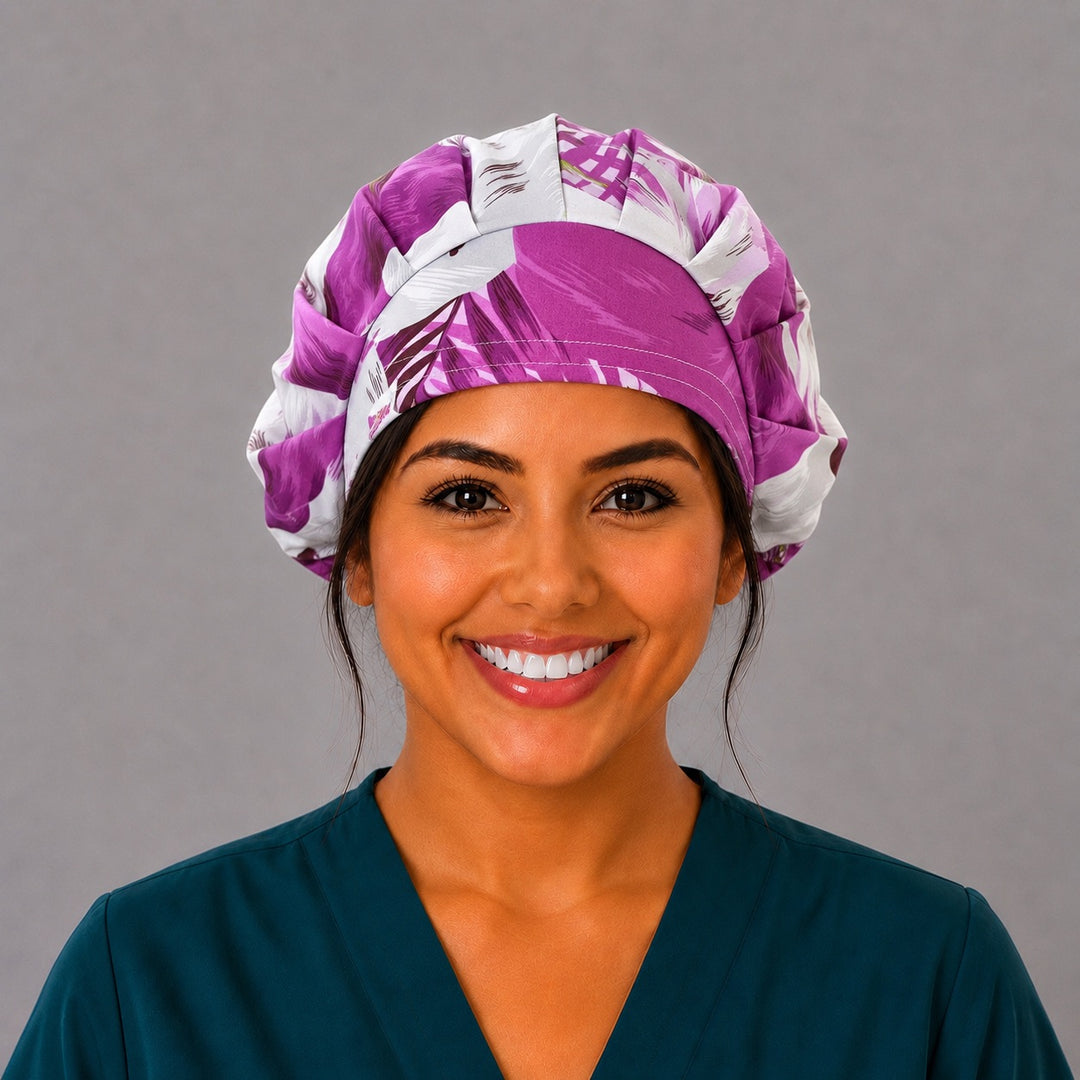 Purple tropical floral bouffant scrub cap for women, front view, violet and plum hibiscus blooms on cream, handmade surgical hat by OR World