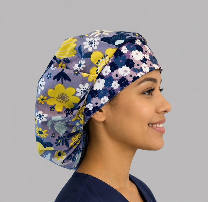 Side view of the purple and yellow floral bouffant surgical hat — lavender bloom print with coordinating band, roomy breathable cotton cap for nurses