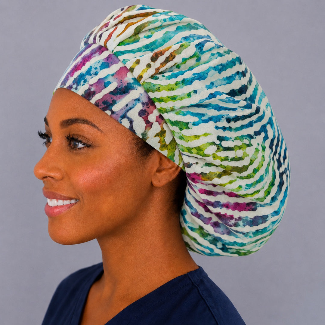 Rainbow animal print bouffant cap for women, left side profile — handmade colorful zebra surgical cap, USA made