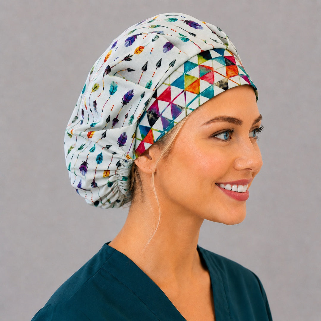 Right side profile of the rainbow arrow and feather bouffant surgical hat — geometric triangle contrast band, roomy breathable cotton cap for nurses