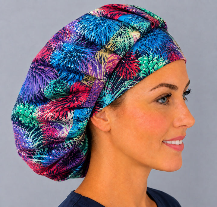 Right side profile of the rainbow firework burst bouffant surgical hat — vibrant celebration print, roomy breathable cotton cap for nurses