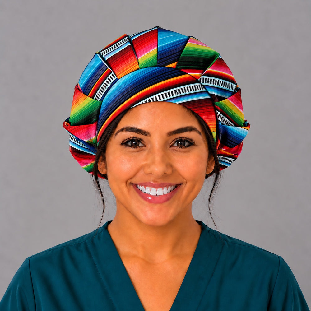 Front view of the rainbow serape bouffant surgical hat, gathered crown in turquoise, red, pink, green and navy sarape stripes