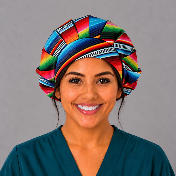 Front view of the rainbow serape bouffant surgical hat, gathered crown in turquoise, red, pink, green and navy sarape stripes