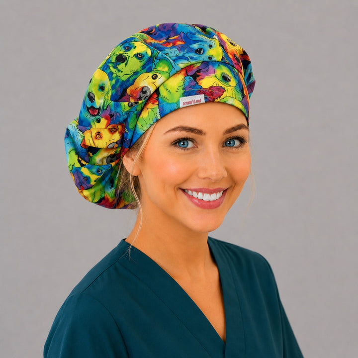Rainbow watercolor dog bouffant scrub cap right side profile with orworld.net label showing colorful dog portraits in rainbow watercolor, OR World veterinary nurse hat
