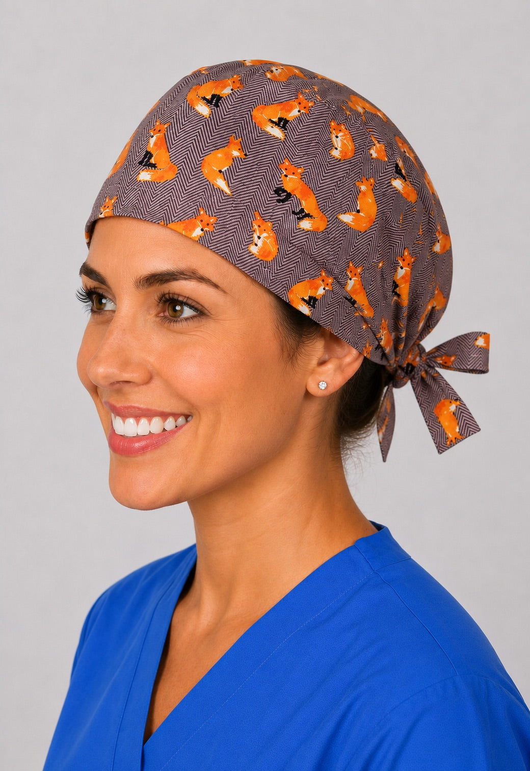 Left profile of red fox scrub cap for women with short hair, woodland veterinary OR cap in gray