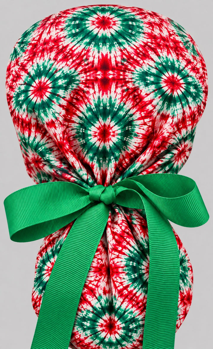 Back of the red and green tie-dye ponytail cap showing the adjustable green grosgrain bow tie