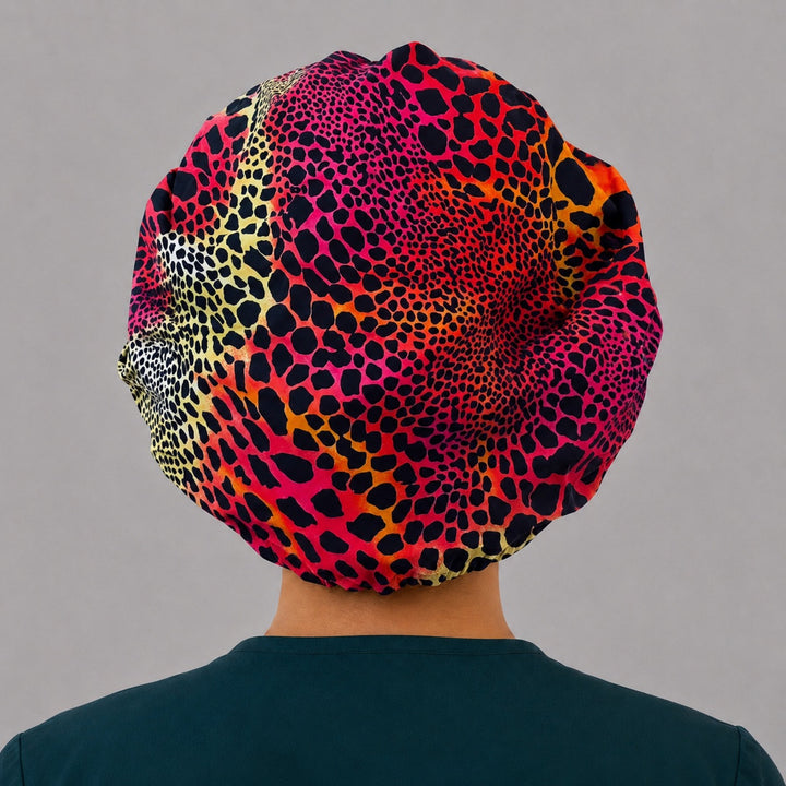 Right side profile of the red and orange leopard bouffant surgical hat — ombré animal print, roomy breathable cotton cap for nurses