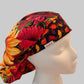 Red sunflower fall bouffant scrub cap with gold, orange & burgundy sunflowers and a fall-leaf band, front view — handmade-in-USA surgical hat for women from OR World.