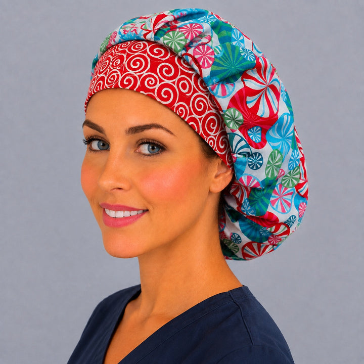 Red and teal peppermint bouffant scrub cap, right angled smiling view — festive candy swirl print for OR nurses and surgical techs