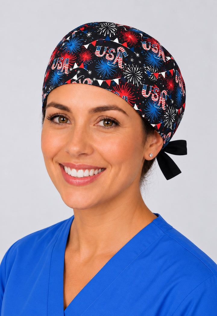 Nurse in Red White and Boom patriotic tie back scrub cap, black USA fireworks surgical hat with side tie by OR World