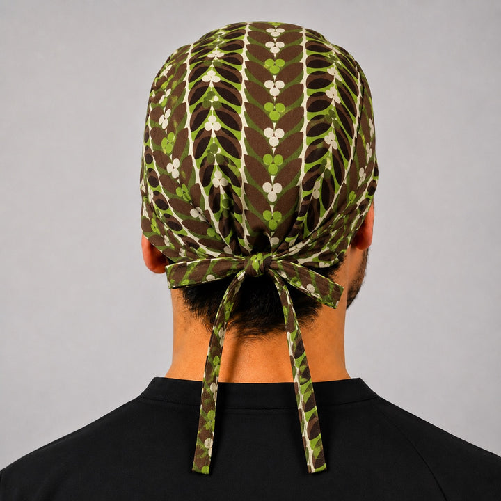 Back view of adjustable tie-back knot on rustic brown and green retro leaf scrub cap surgical hat for men