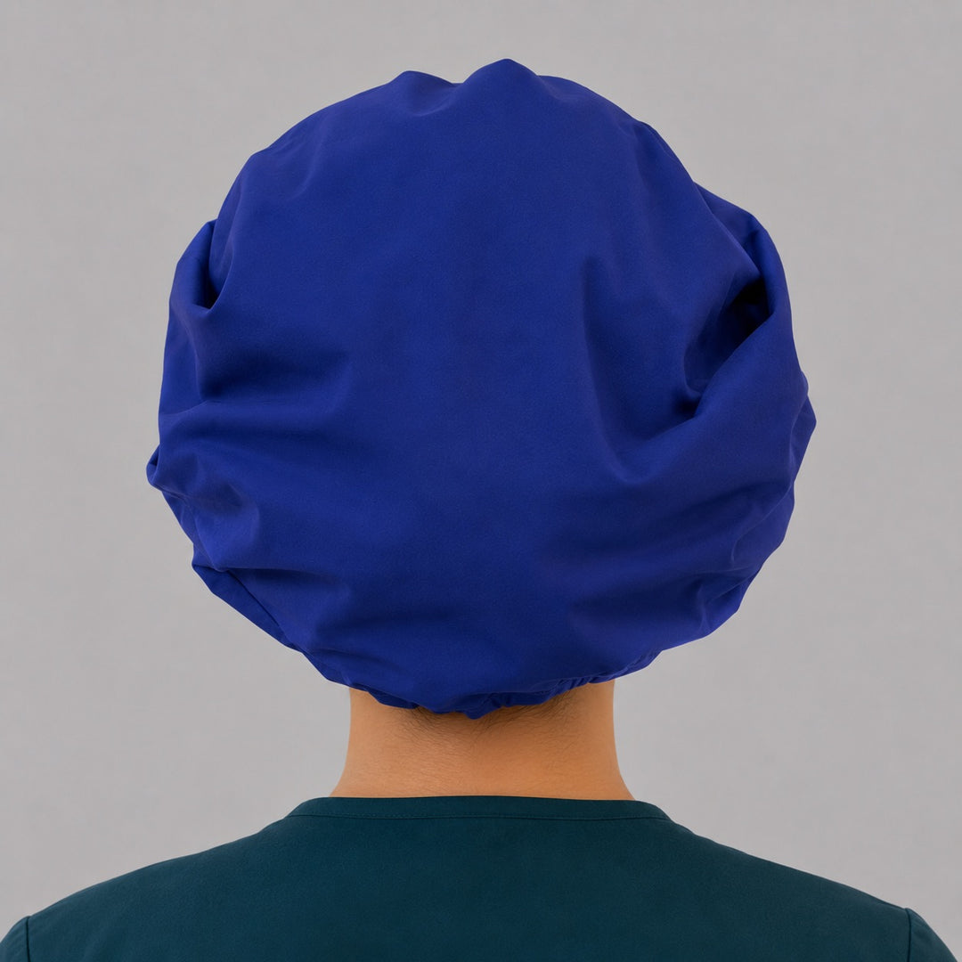Royal blue bouffant scrub cap back view showing full gathered solid royal blue crown and elastic closure, OR World surgical hat
