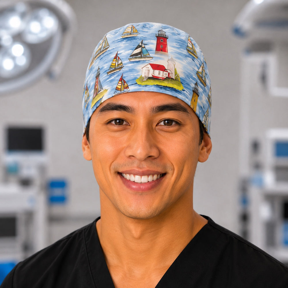 Sailboat and lighthouse nautical scrub cap in ocean blue, handmade men's tie-back coastal surgical hat on male OR nurse, front view