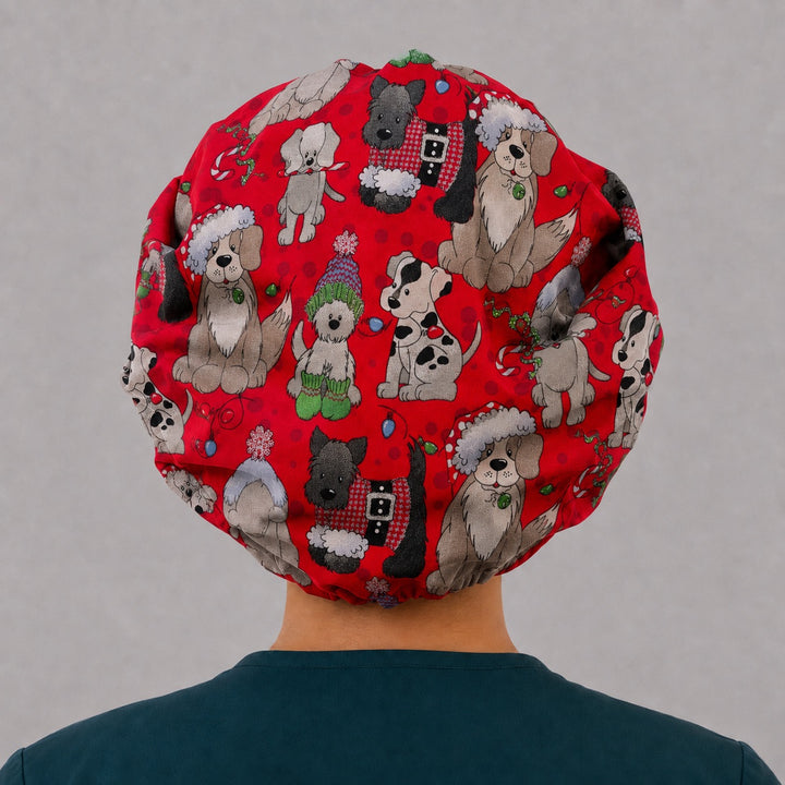 Right side profile of the Santa hat puppy bouffant surgical hat — red holiday dog print with polka-dot band, roomy breathable cotton cap