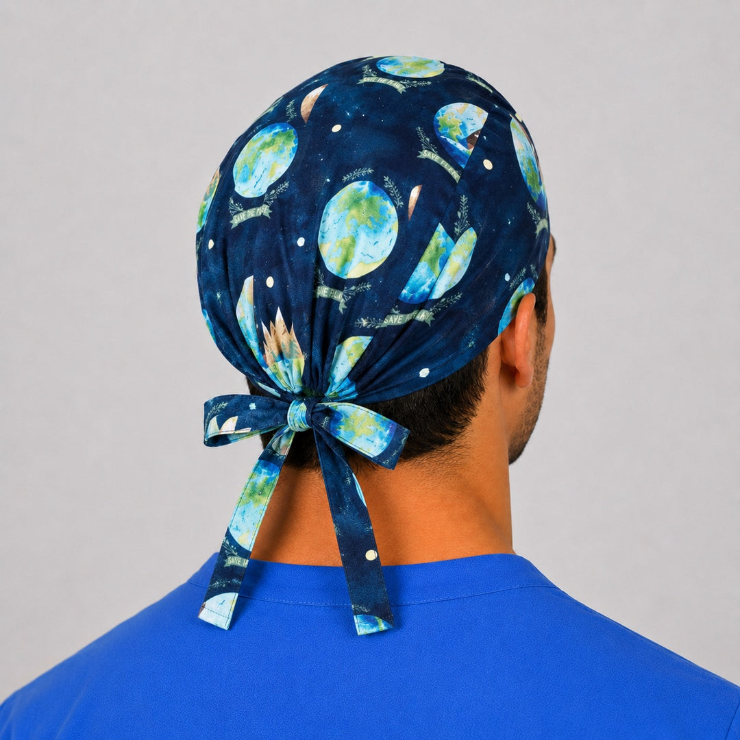 Back view of the Save the Planet tie-back scrub cap showing the bow tie closure and full Earth and trees print