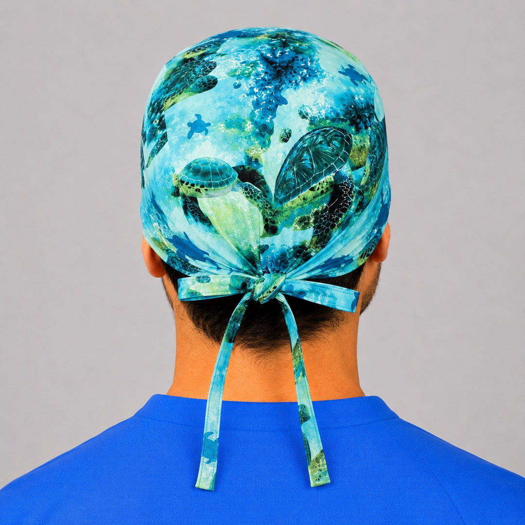 Back view of the sea turtle tie-back scrub cap — tropical underwater ocean print, coastal OR nurse cap, adjustable fit