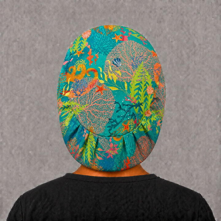 Right side profile of the seahorse coral Euro surgical hat — sea fans, starfish and kelp print, breathable cotton cap for OR nurses