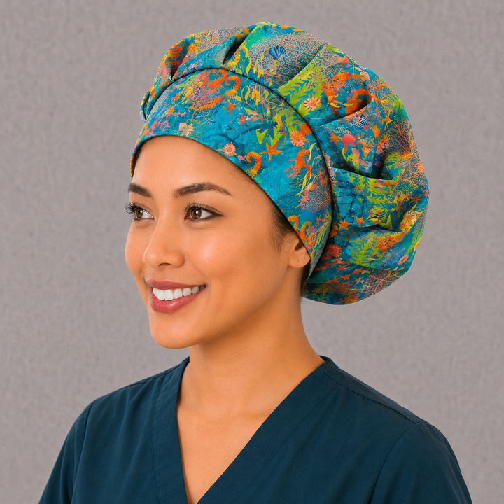 Left side profile of the seahorse coral reef bouffant surgical hat — sea fans, starfish and kelp print, roomy breathable cotton cap for nurses