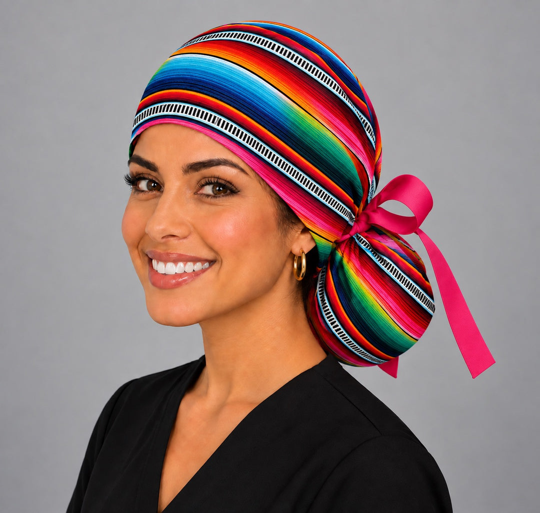 Right side of a serape ponytail scrub cap for long hair with pink bow and gorro mexicano stripes