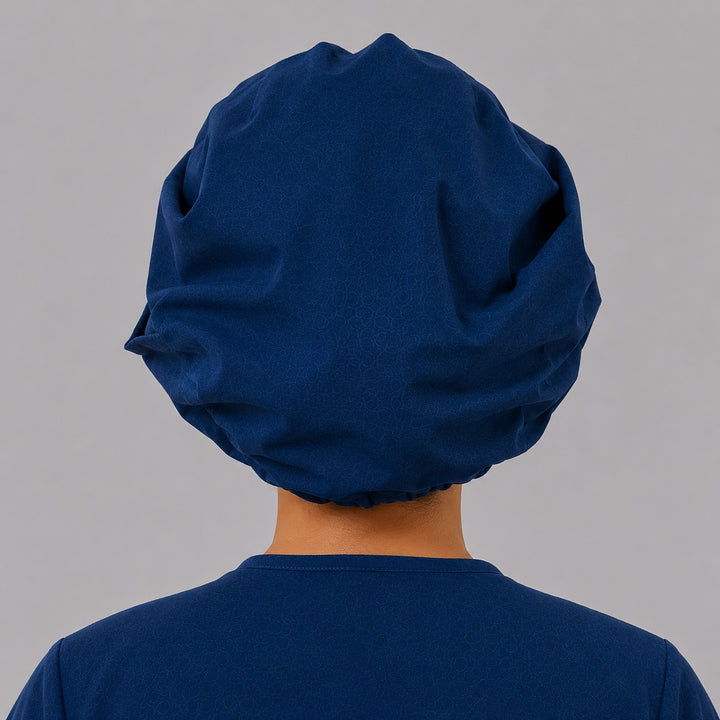 Back view of the navy SGO official bouffant surgical scrub cap showing the full bouffant fit that covers long hair