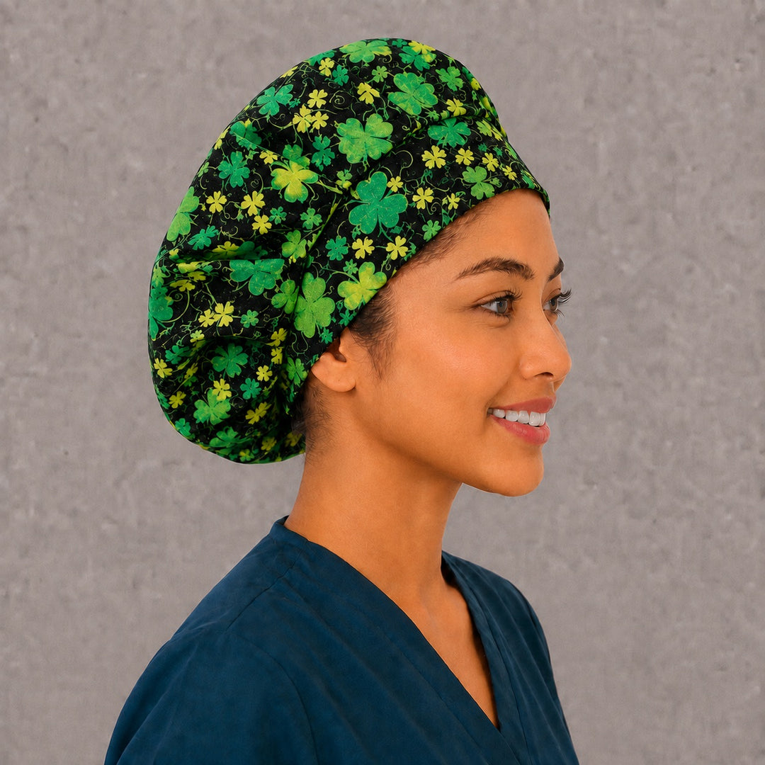 Right side profile of the shamrock glitter bouffant surgical hat — emerald and lime clovers on black, roomy breathable cotton cap for nurses