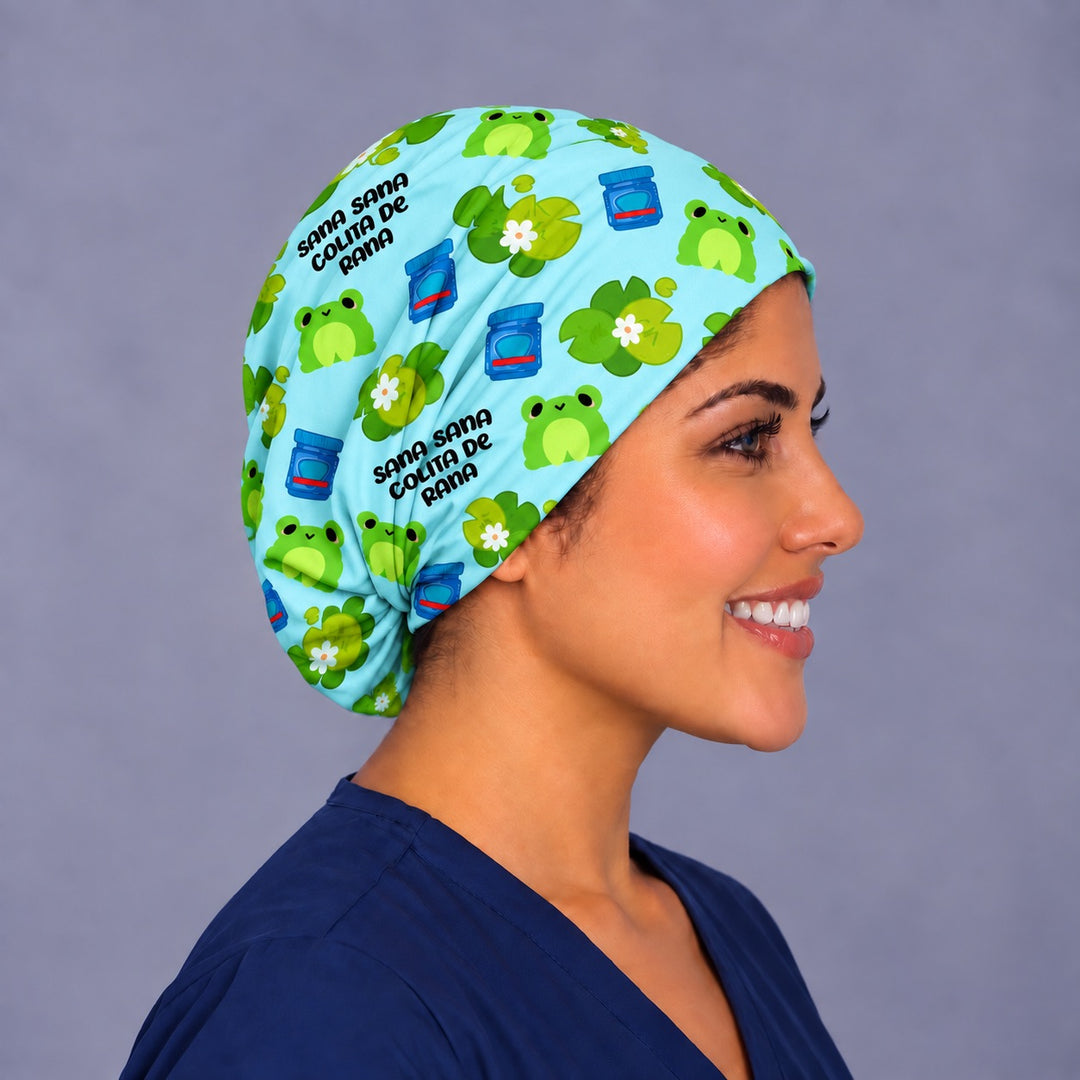 Opposite side profile of a sky blue frog OR cap in 100% cotton, showing the adjustable elastic gathered low at the nape behind the ear