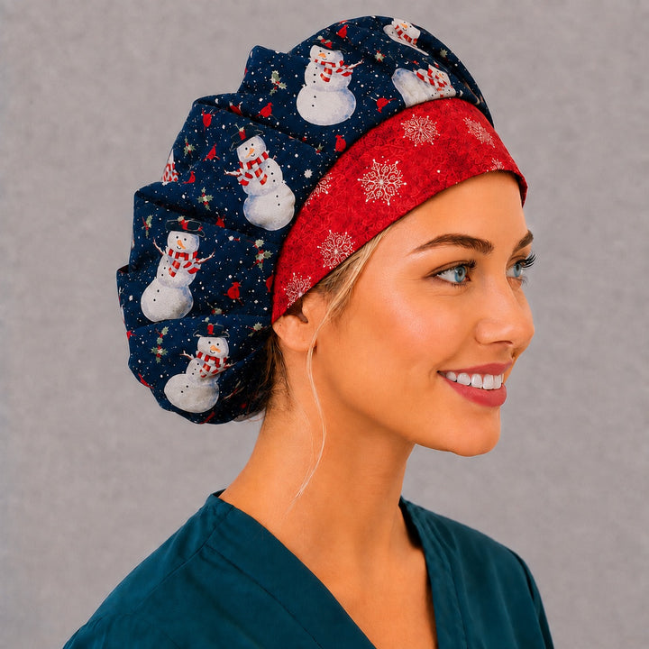 Snowman and cardinal bouffant cap for women, right angled smiling view — handmade black winter holiday surgical cap, USA made