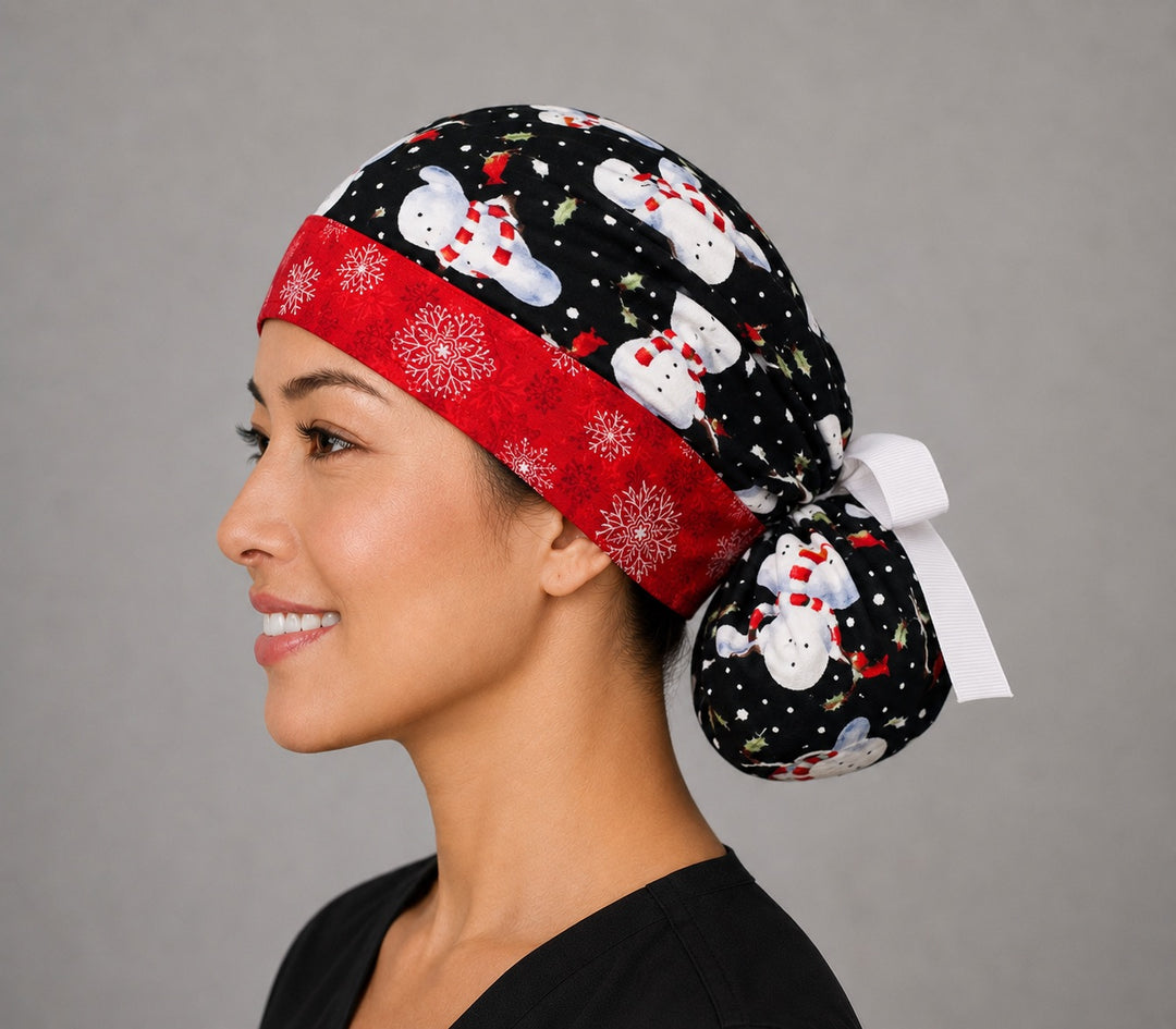 Snowmen ponytail scrub cap right side profile with full ponytail pouch of snowmen in striped scarves on black and long white ribbon ties