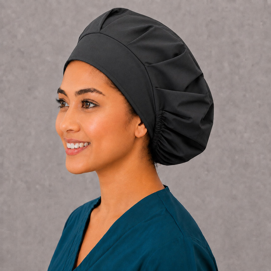 Left side profile of the solid black bouffant surgical hat — roomy elastic gathered back, breathable cotton cap for OR staff