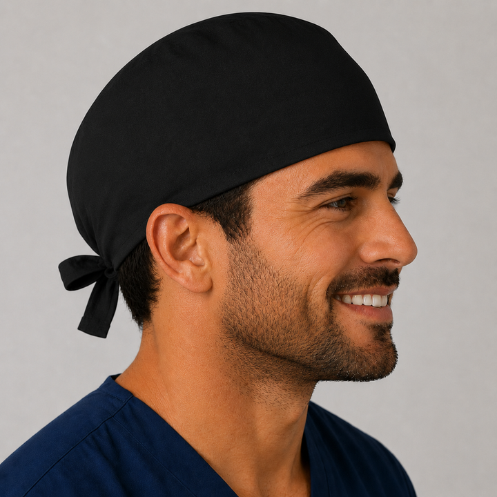 Man wearing a solid black tie-back scrub cap, front view — handmade-in-USA men&
