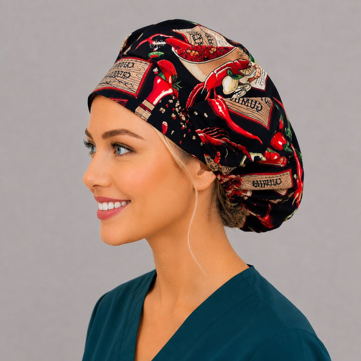 Profile view of the spicy food print bouffant surgical hat for women — chili peppers and Cajun labels, roomy cap that secures thick hair