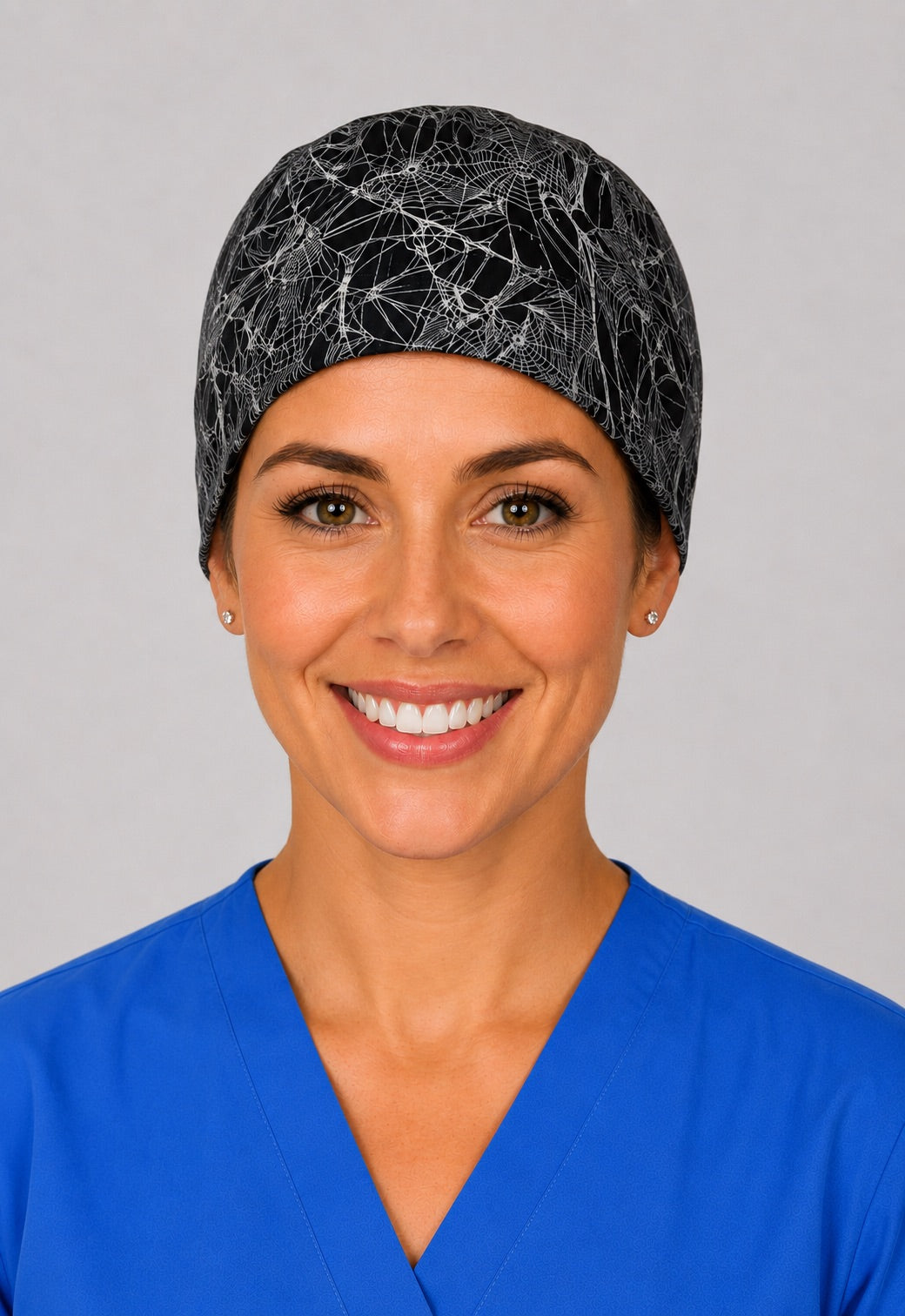 Back view of adjustable tie-back knot on black spider web unisex surgical hat