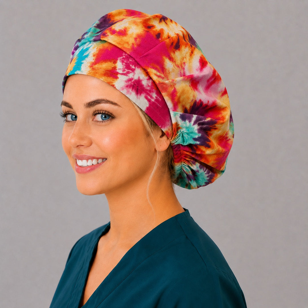Spiral tie-dye bouffant surgical cap for long hair, right angled view — deep gathered fit that secures thick or braided hair
