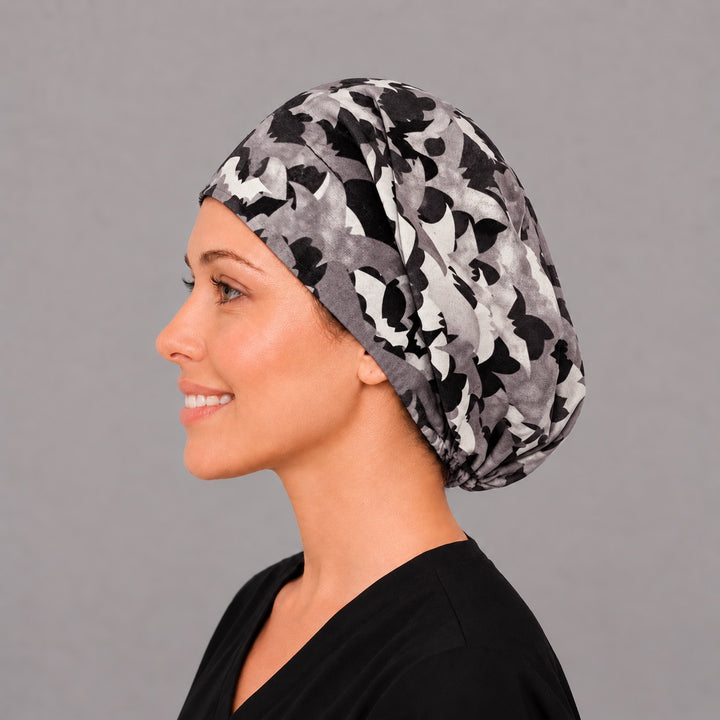 Spooky bat Euro scrub cap, left side profile — charcoal and white bat print for OR nurses and surgical techs