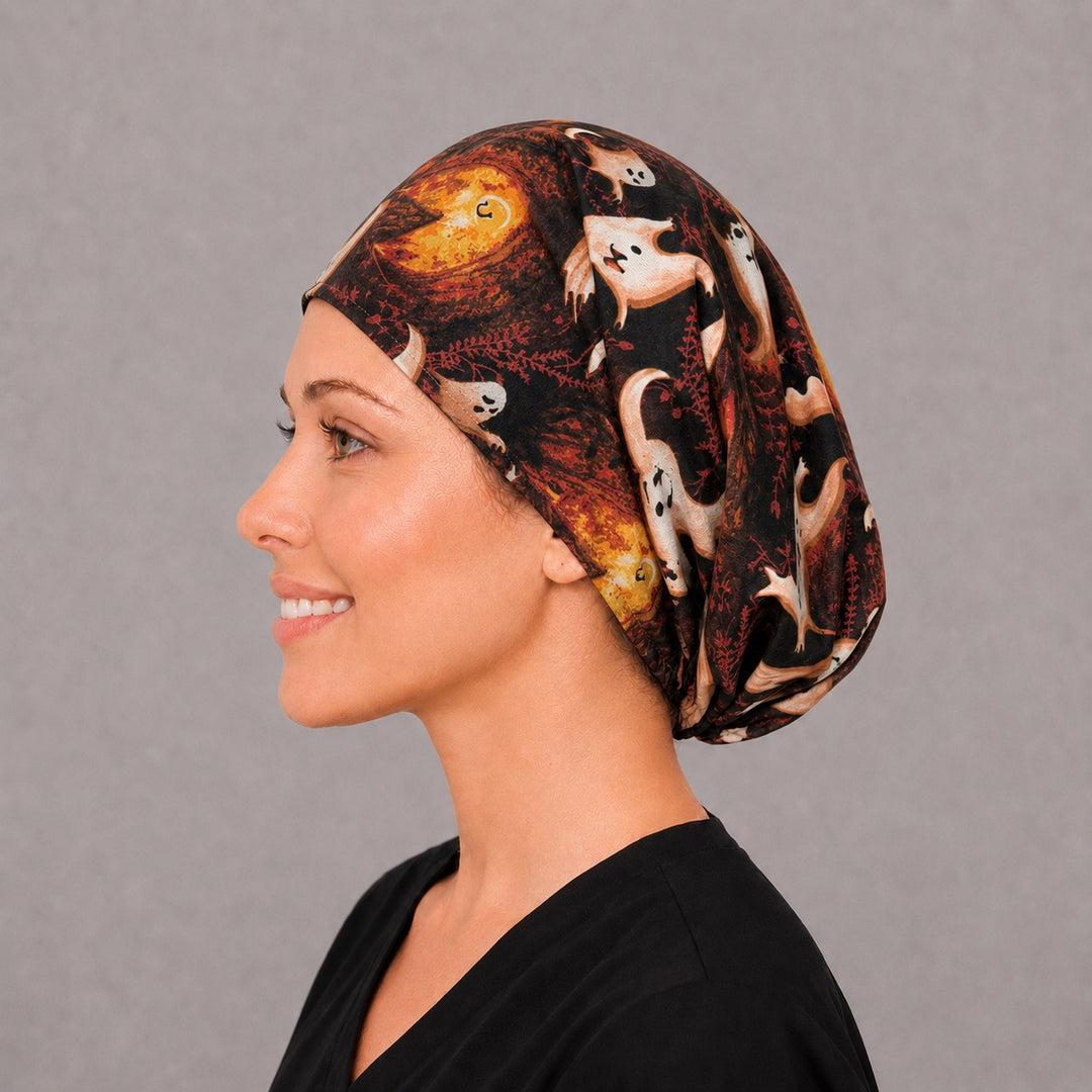 Left side profile of the spooky ghost Euro surgical hat — harvest moon and haunted house print, breathable cotton cap for nurses