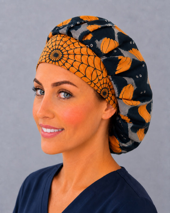 Spooky season bouffant surgical cap for women, three-quarter view — cat and pumpkin print bouffant scrub hat, breathable cotton