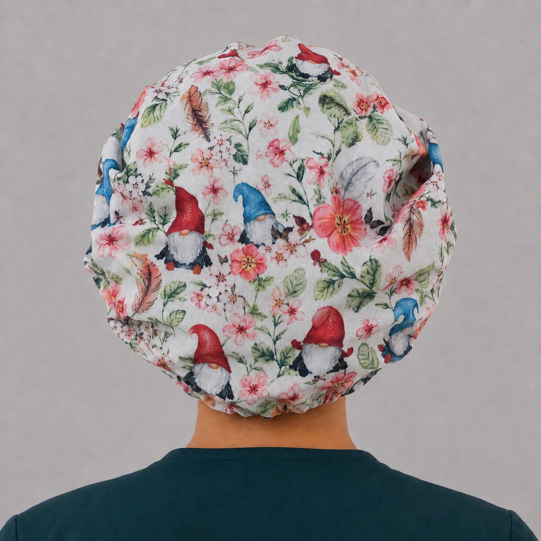 Back view of the spring gnome bouffant scrub cap — full gathered coverage showing gnomes, blossoms and feathers across the crown